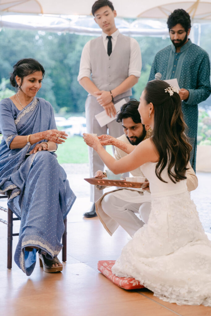 bride serving mother-in-law tea